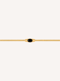 Gold snake chain bracelet with an oval black onyx stone centerpiece.