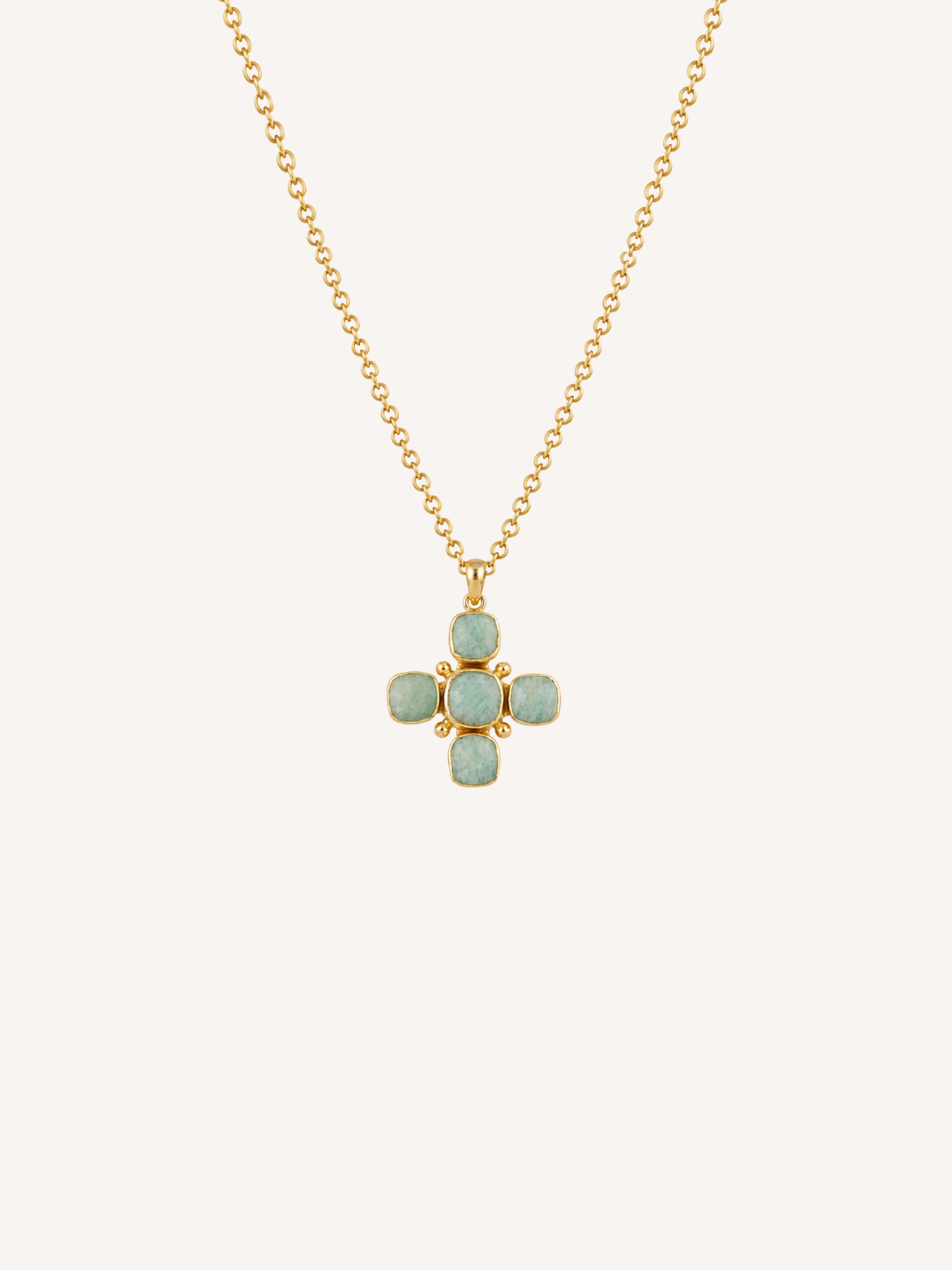 Gold cross pendant necklace featuring genuine amazonite stones in a soft rounded cross design.