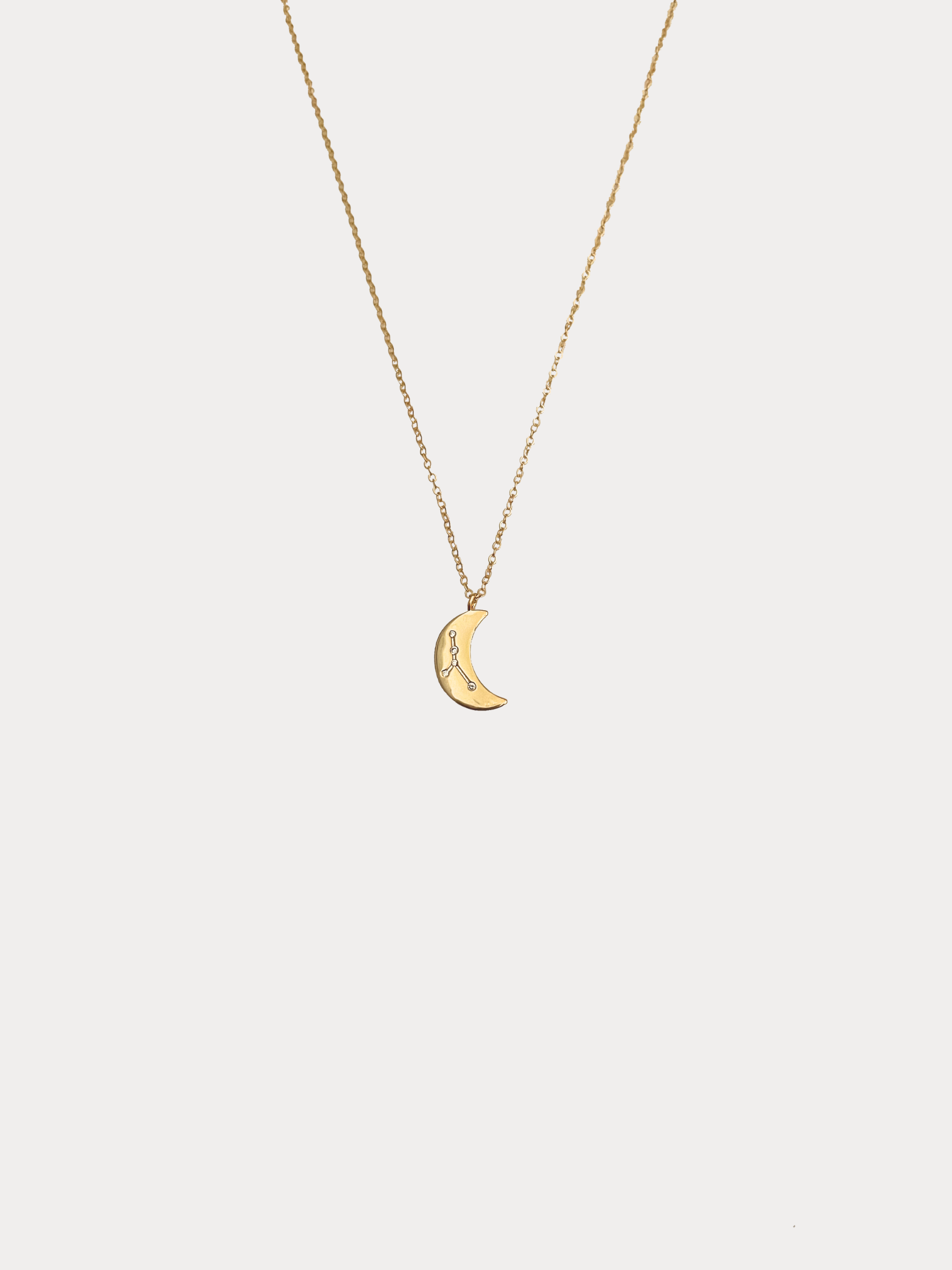 Gold Cancer crescent moon necklace with constellation detailing