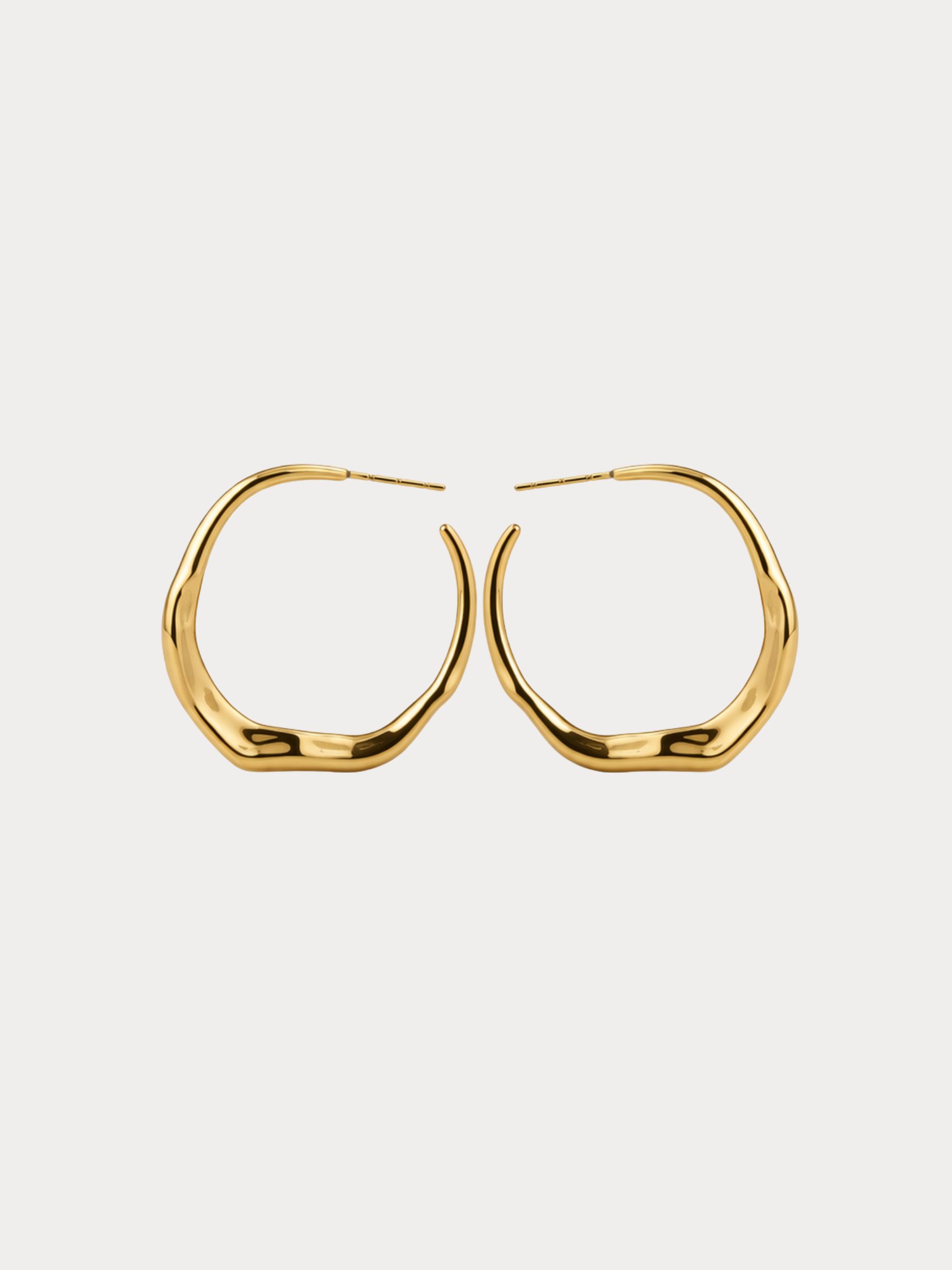gold sculptural molten hoop earrings with organic fluid shape