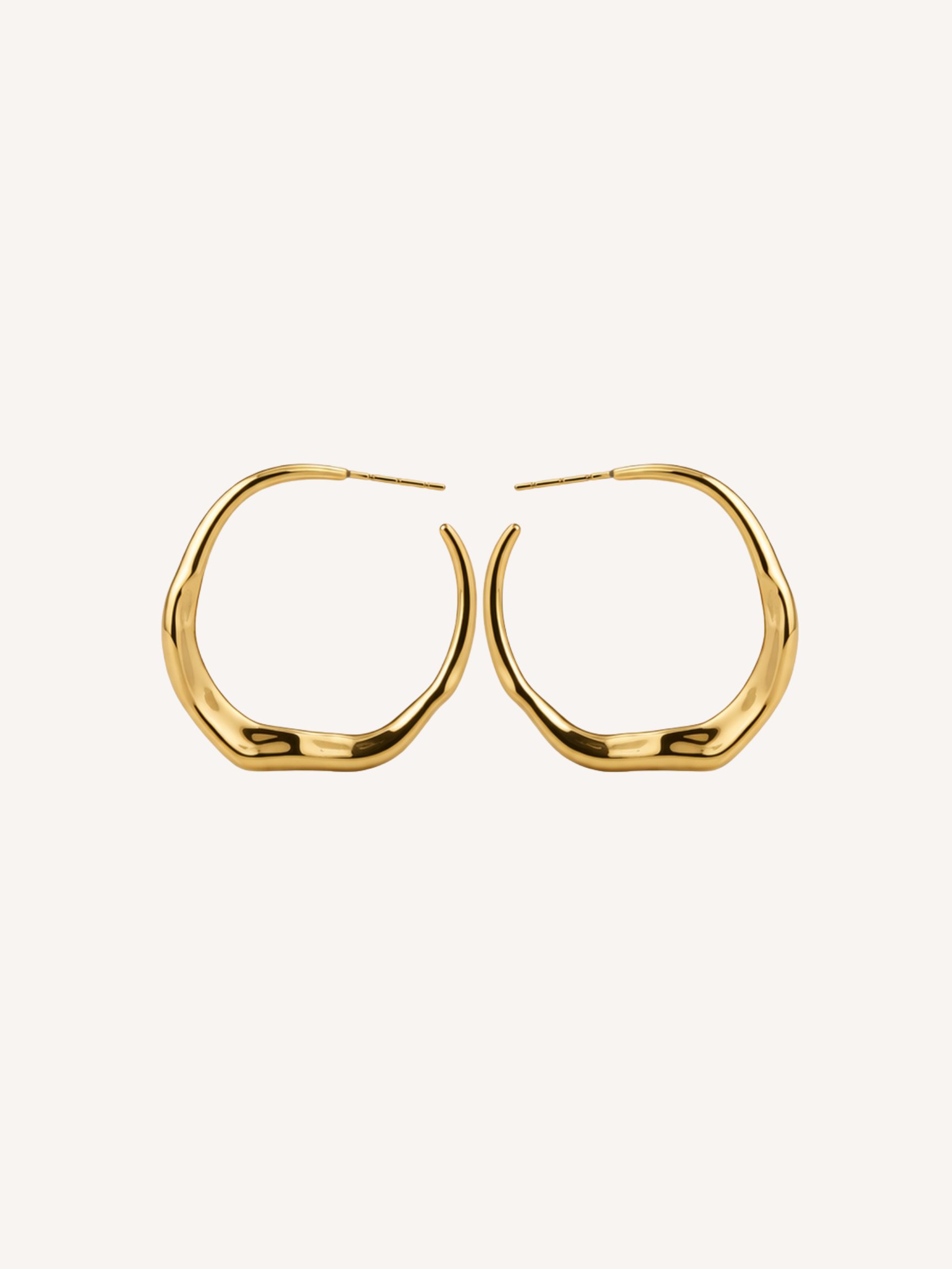 gold sculptural molten hoop earrings with organic fluid shape