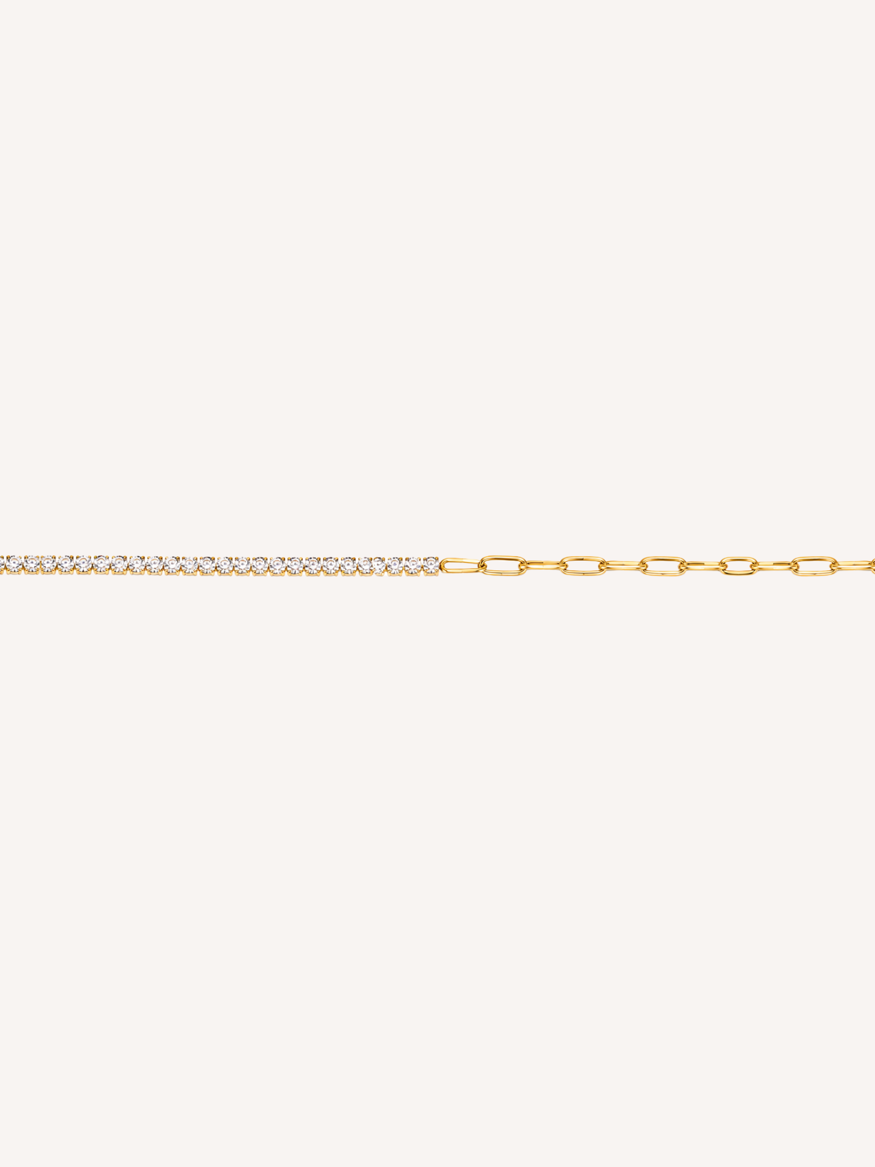 Gold bracelet featuring cubic zirconia stones paired with elongated paperclip links.