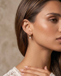 jacquie gold plated pearl huggie hoop earrings close up side profile worn
