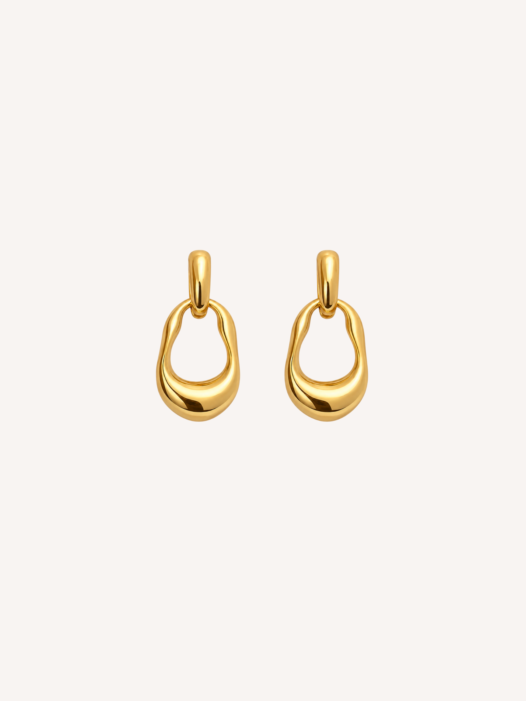 Gold sculptural drop earrings with a polished molten silhouette.