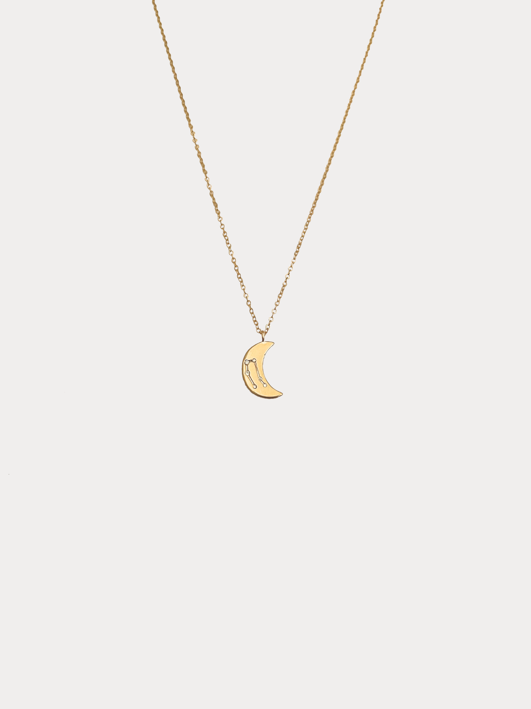 Gold Gemini crescent moon necklace with constellation detailing