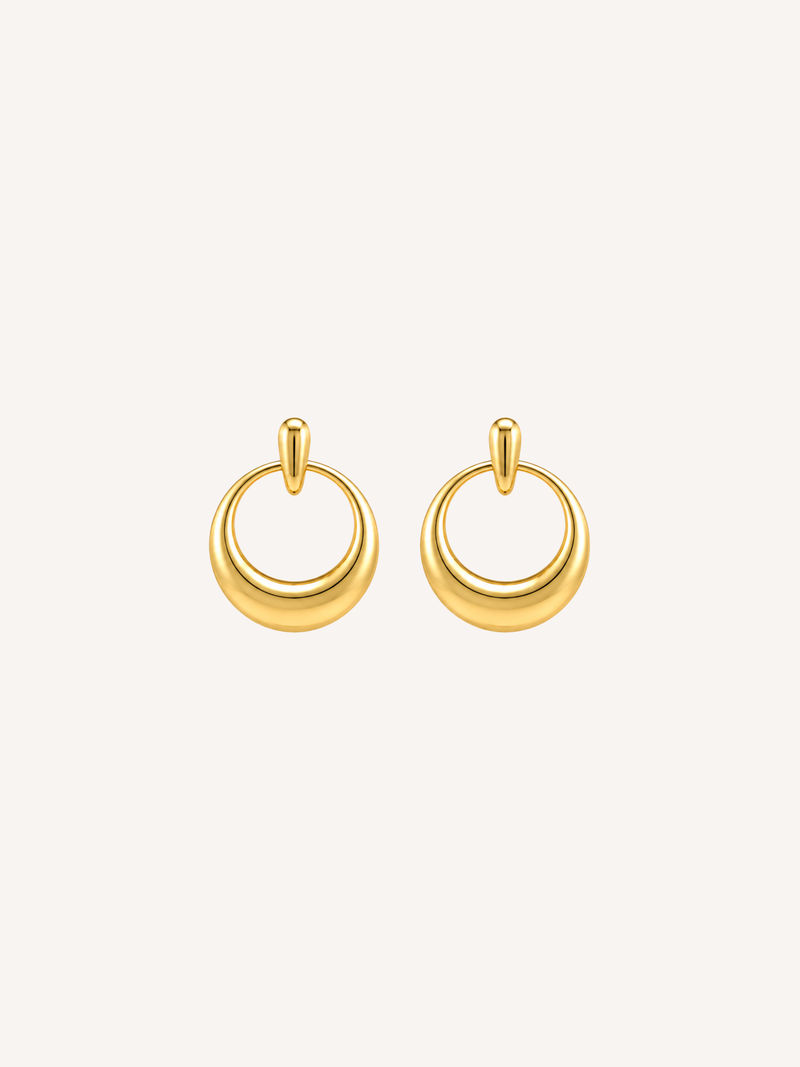 Gold circle stud earrings featuring a sculptural open-circle silhouette and polished finish.