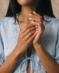 gold plated interlocking pave crystal ring worn on model stacking ring