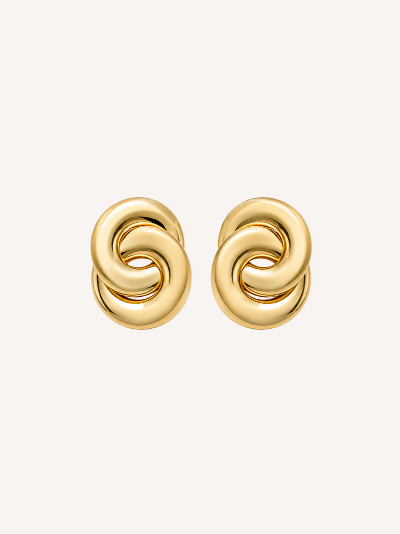 Chunky gold knot stud earrings featuring an interlocking sculptural design and polished finish.
