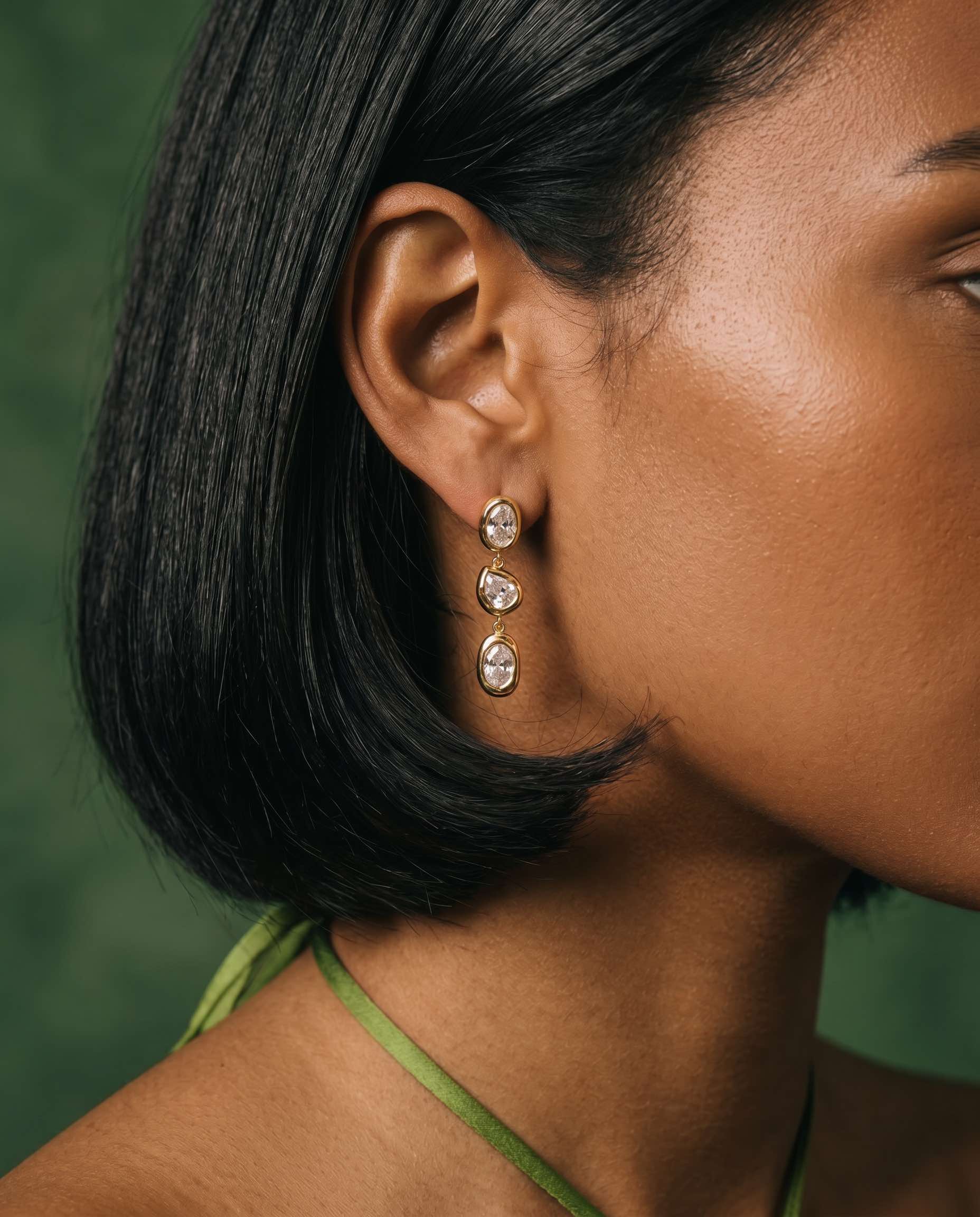 gold plated molten bezel drop earrings cz crystal worn on model side profile