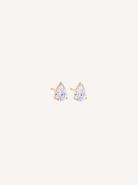 Tiny gold stud earrings with pear-cut cubic zirconia stones held by claw prongs.