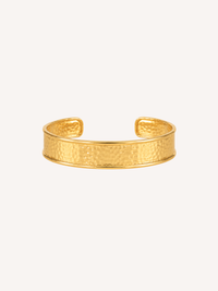Hammered gold cuff bracelet with a wide textured open cuff design.