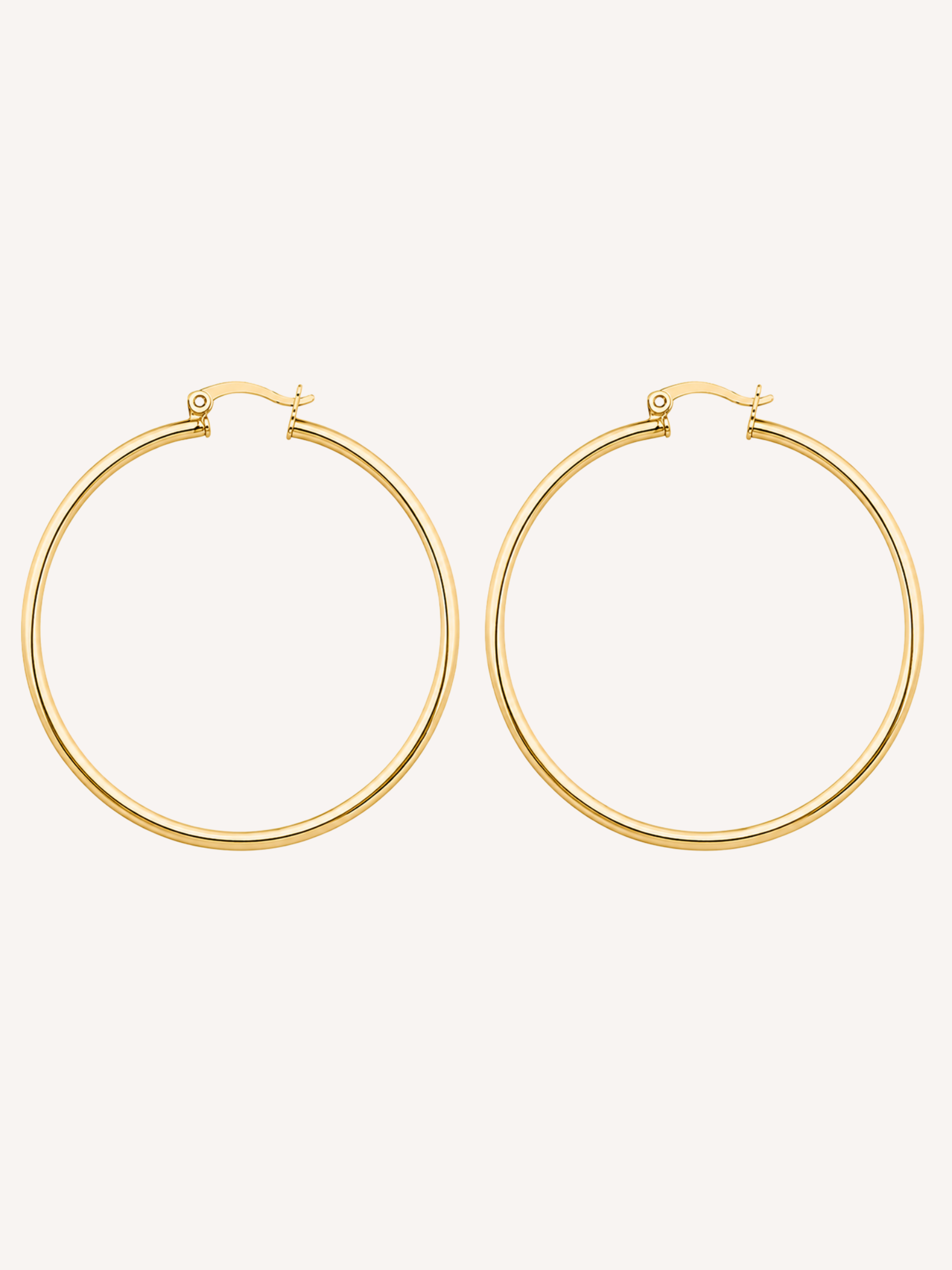 18k large gold hoop earrings with a thin tube silhouette and polished tarnish free waterproof finish.