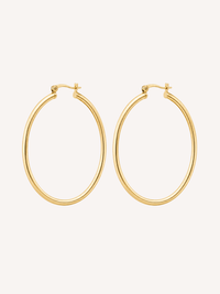 Large gold hoop earrings with a thin tubular silhouette and polished finish.
