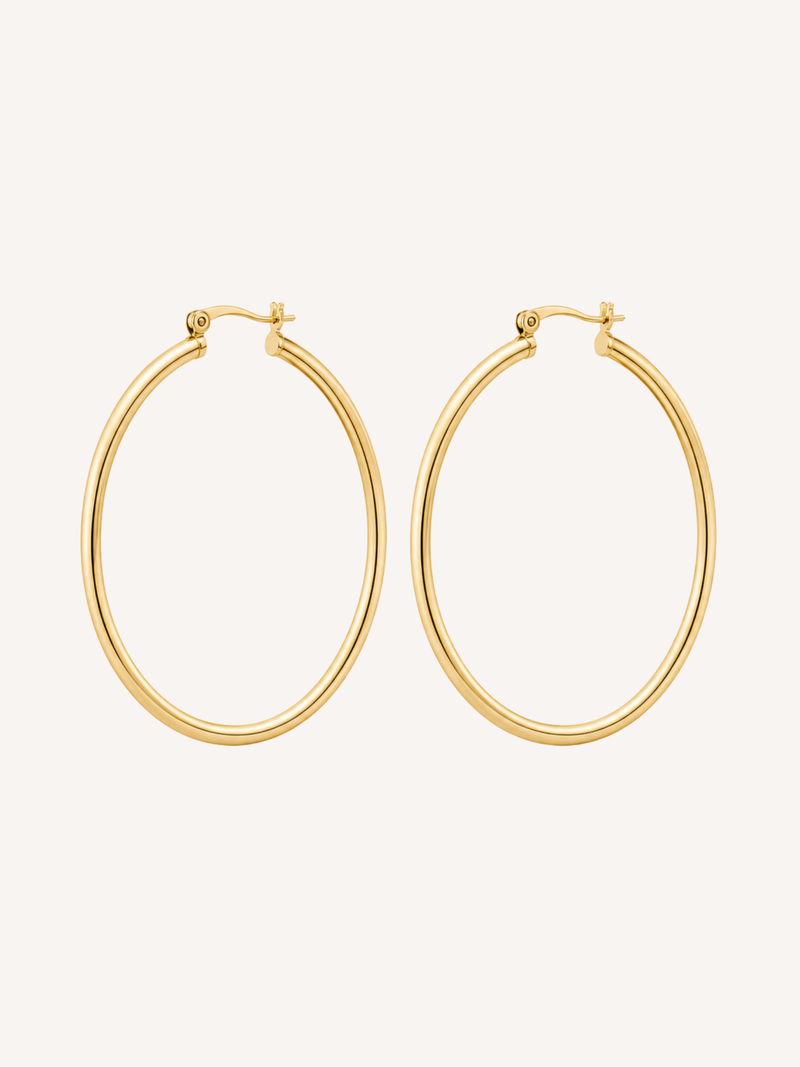 Large gold hoop earrings with a thin tubular silhouette and polished finish.
