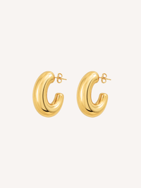 Chunky gold hoop earrings featuring a thick tubular silhouette and polished finish.