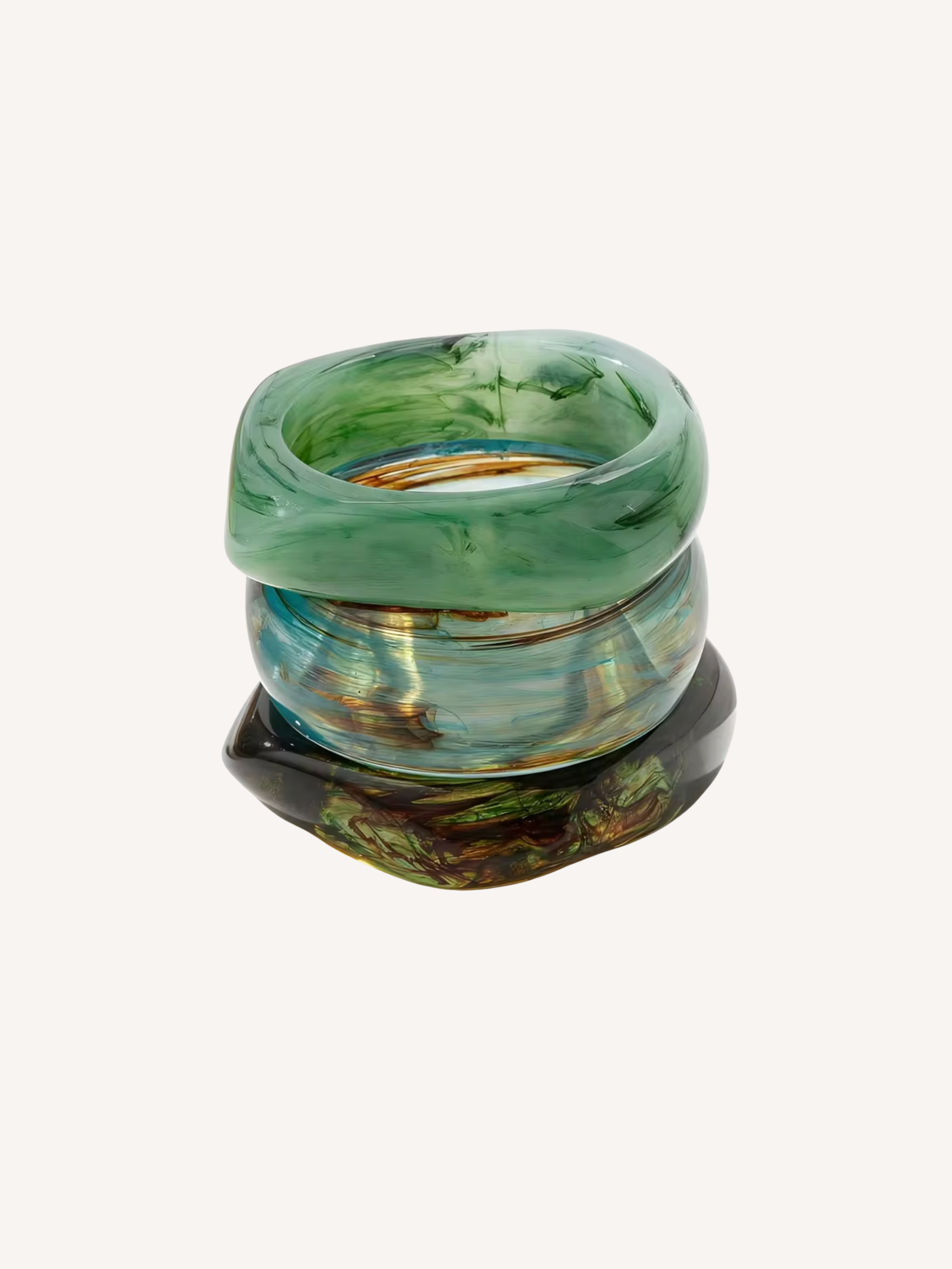 Set of three chunky resin bangles in seafoam green, translucent aqua, and deep marbled green finishes.