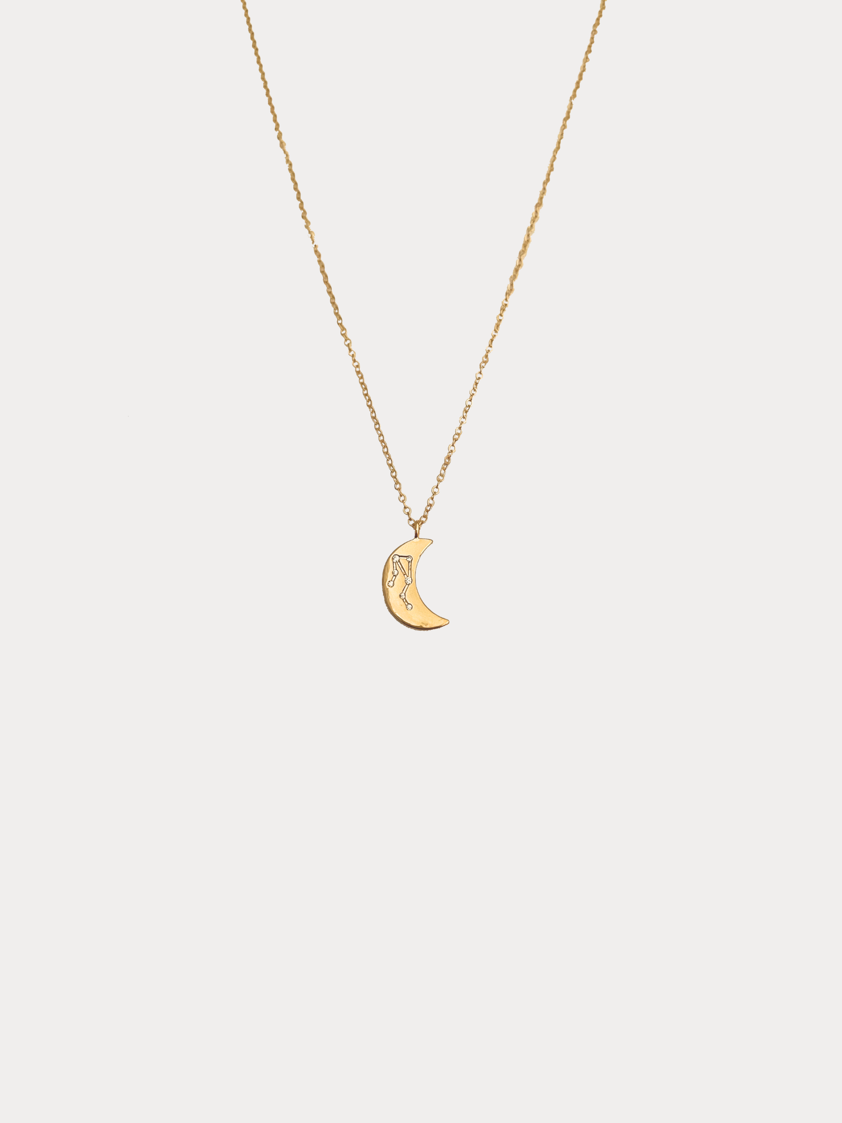 Gold Libra crescent moon necklace with constellation detailing