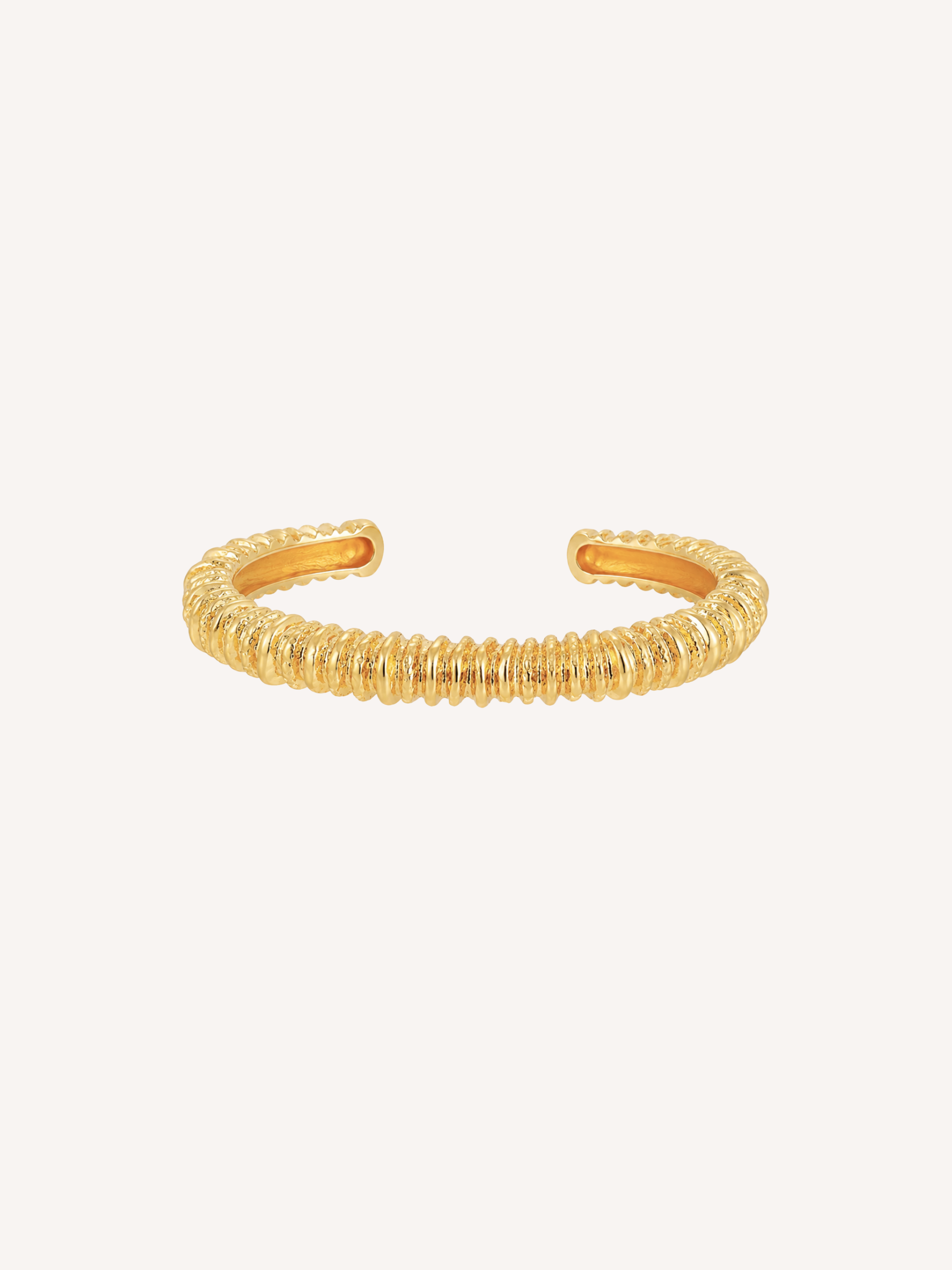 Magma gold ridged cuff bracelet with sculptural molten texture.