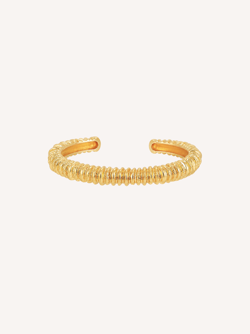 Magma gold ridged cuff bracelet with sculptural molten texture.