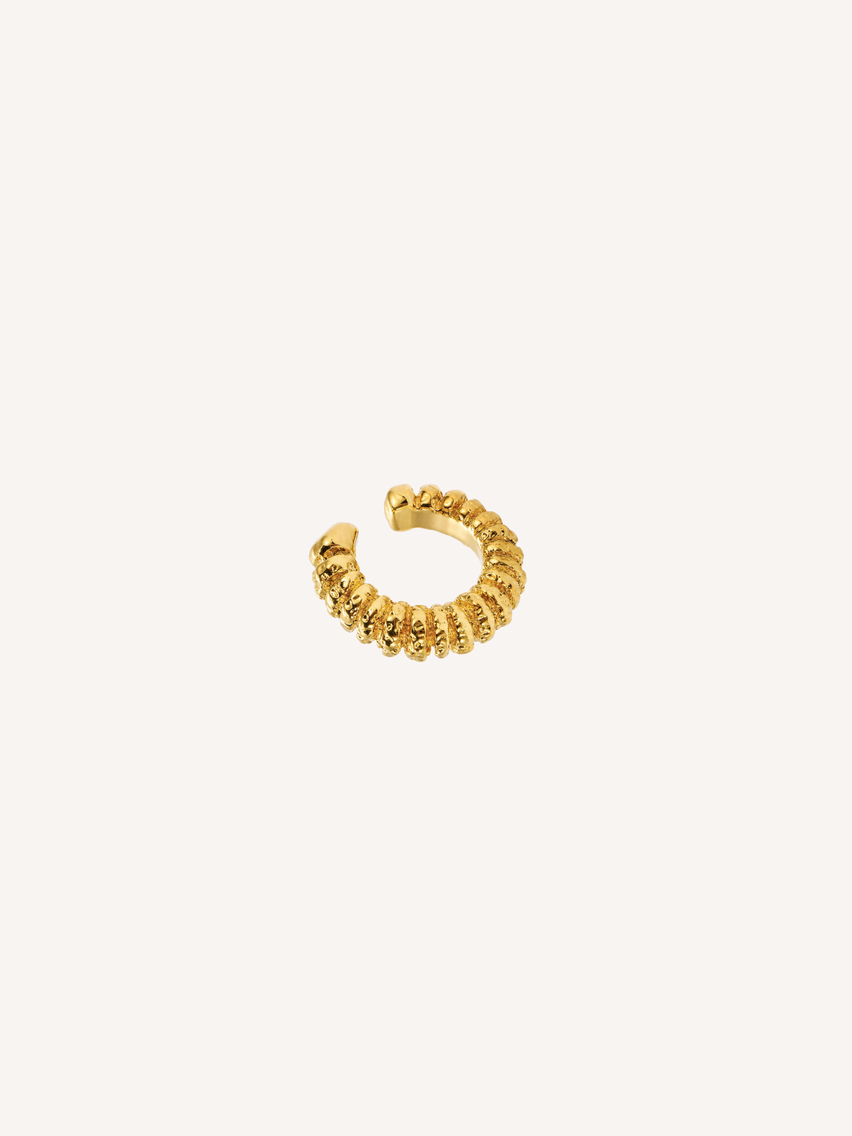 Gold textured Magma Ear Cuff with sculptural ridged detailing.