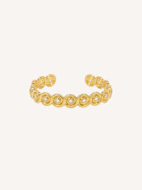 Gold open cuff bracelet inspired by a conch shell with bezel-set Cubic Zirconia stones.