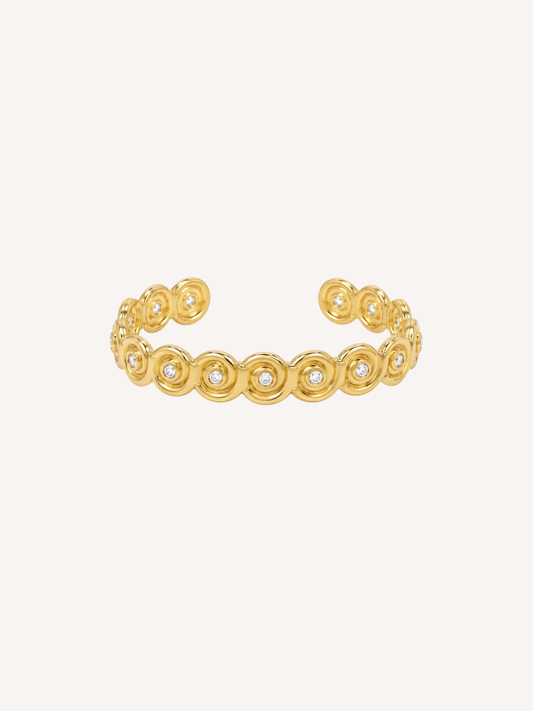 Gold open cuff bracelet inspired by a conch shell with bezel-set Cubic Zirconia stones.