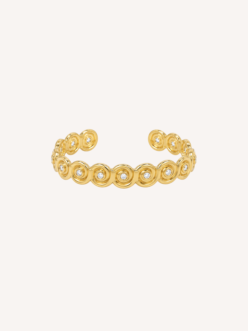 Gold open cuff bracelet inspired by a conch shell with bezel-set Cubic Zirconia stones.