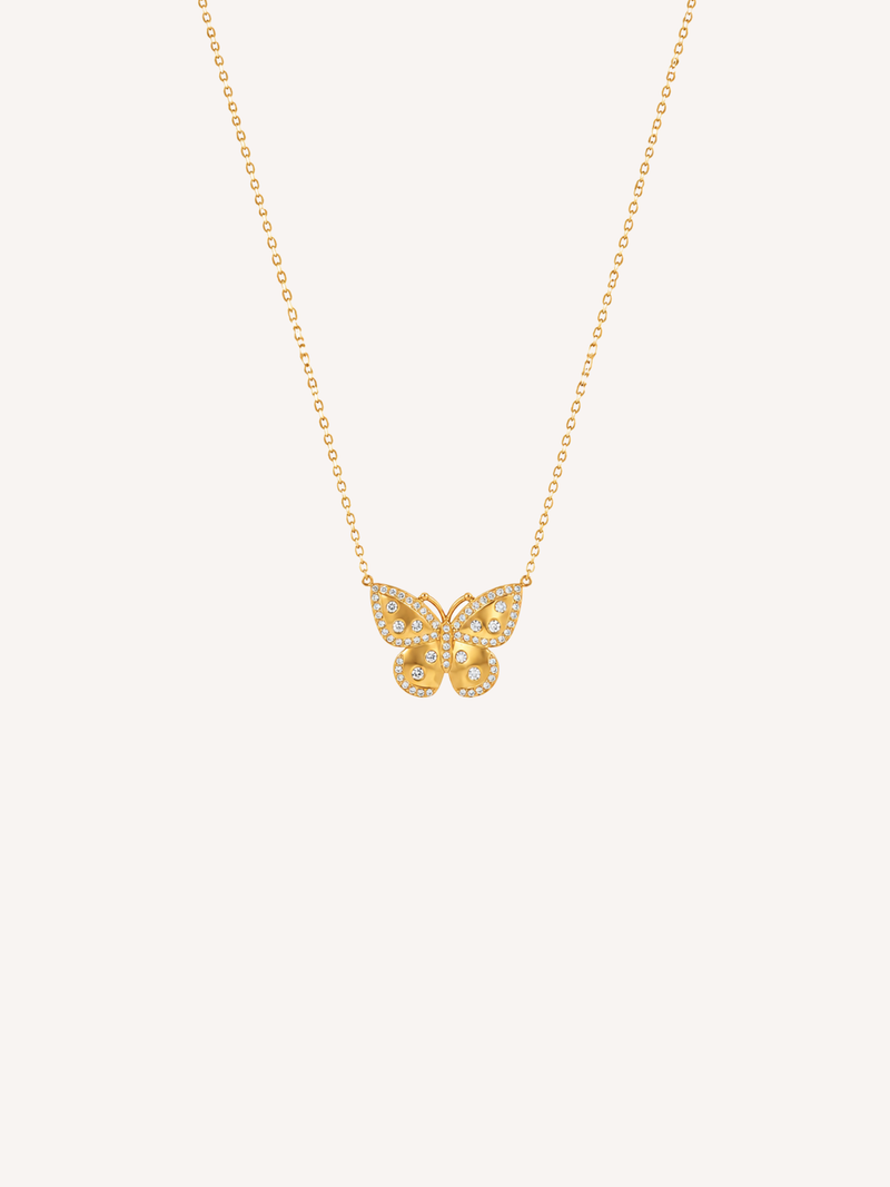 Gold butterfly necklace featuring cubic zirconia stones and a delicate pendant design.
