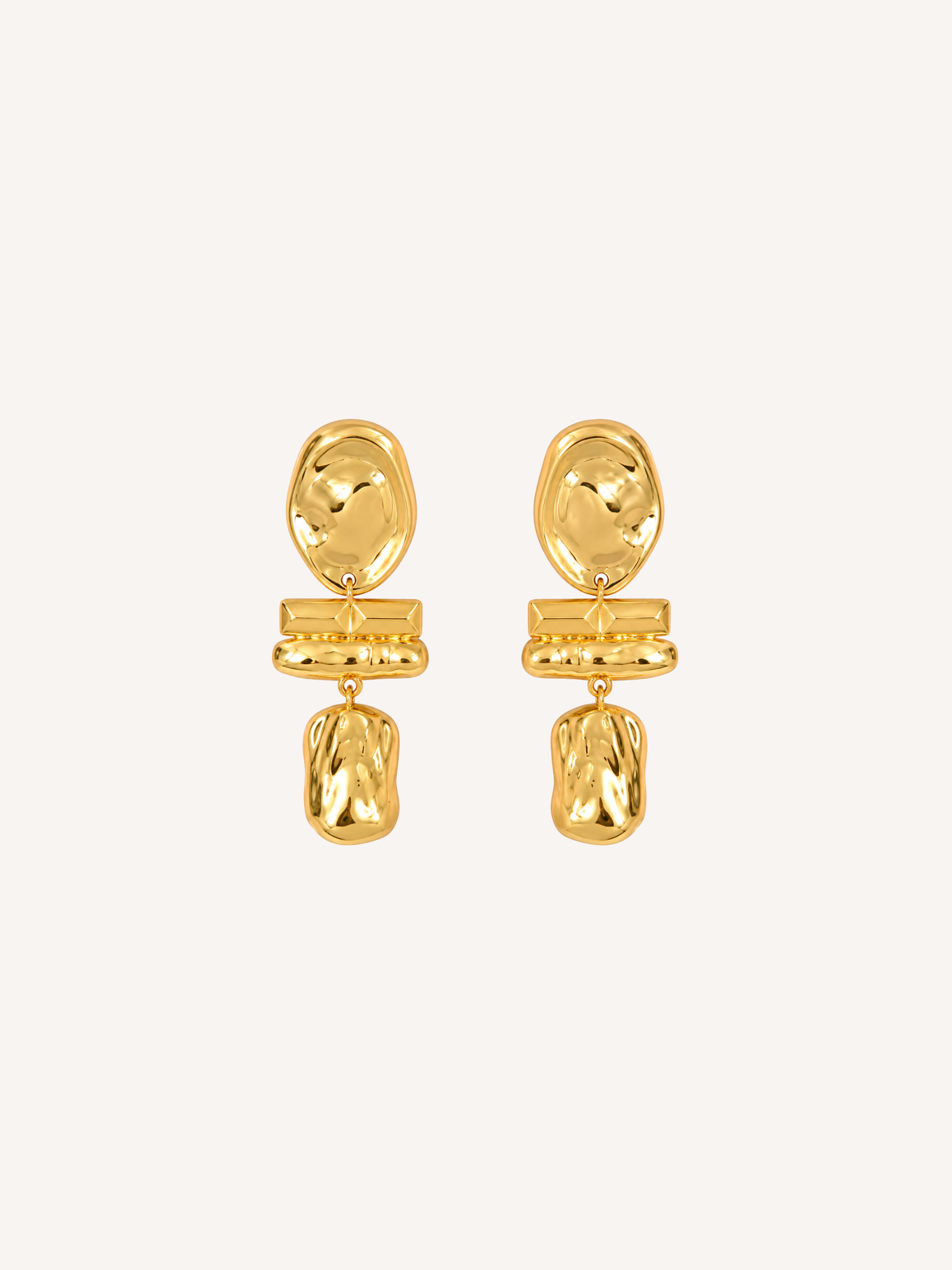 Sculptural gold statement earrings featuring an abstract molten drop design.