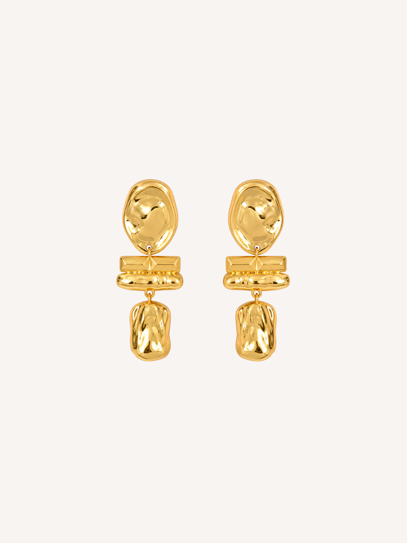 Sculptural gold statement earrings featuring an abstract molten drop design.