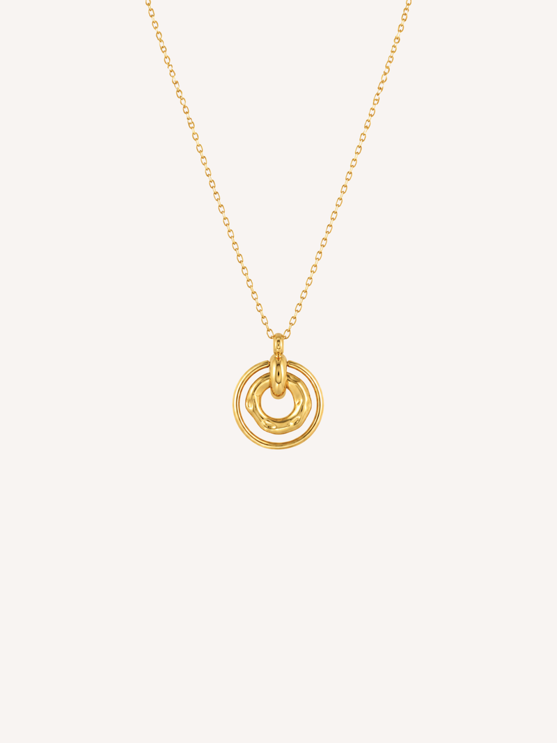 Waterproof gold circle necklace with layered rings and an organic molten center pendant.