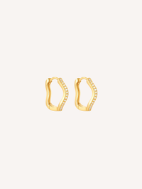 Gold pavé wave huggie earrings featuring cubic zirconia stones and an organic scalloped silhouette.