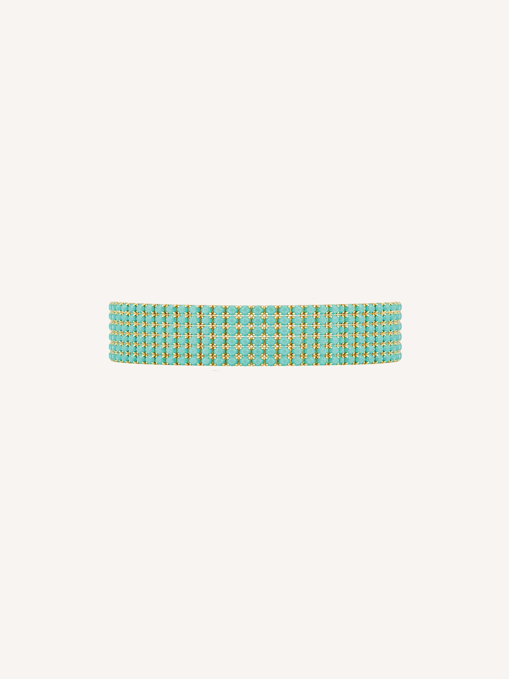 Gold tennis bracelet featuring peacock green cubic zirconia stones.