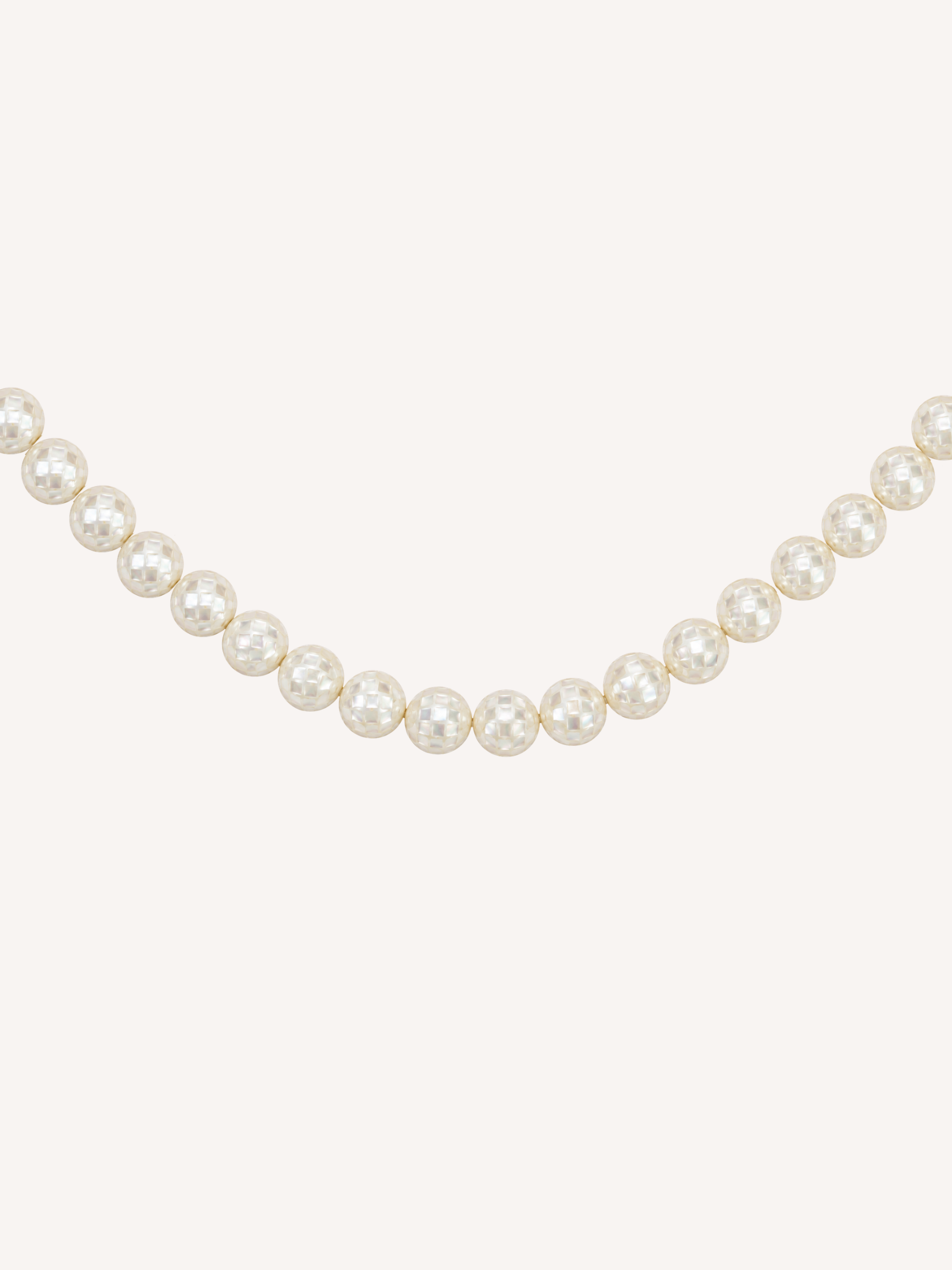 Gold necklace featuring luminous mosaic mother of pearl beads.