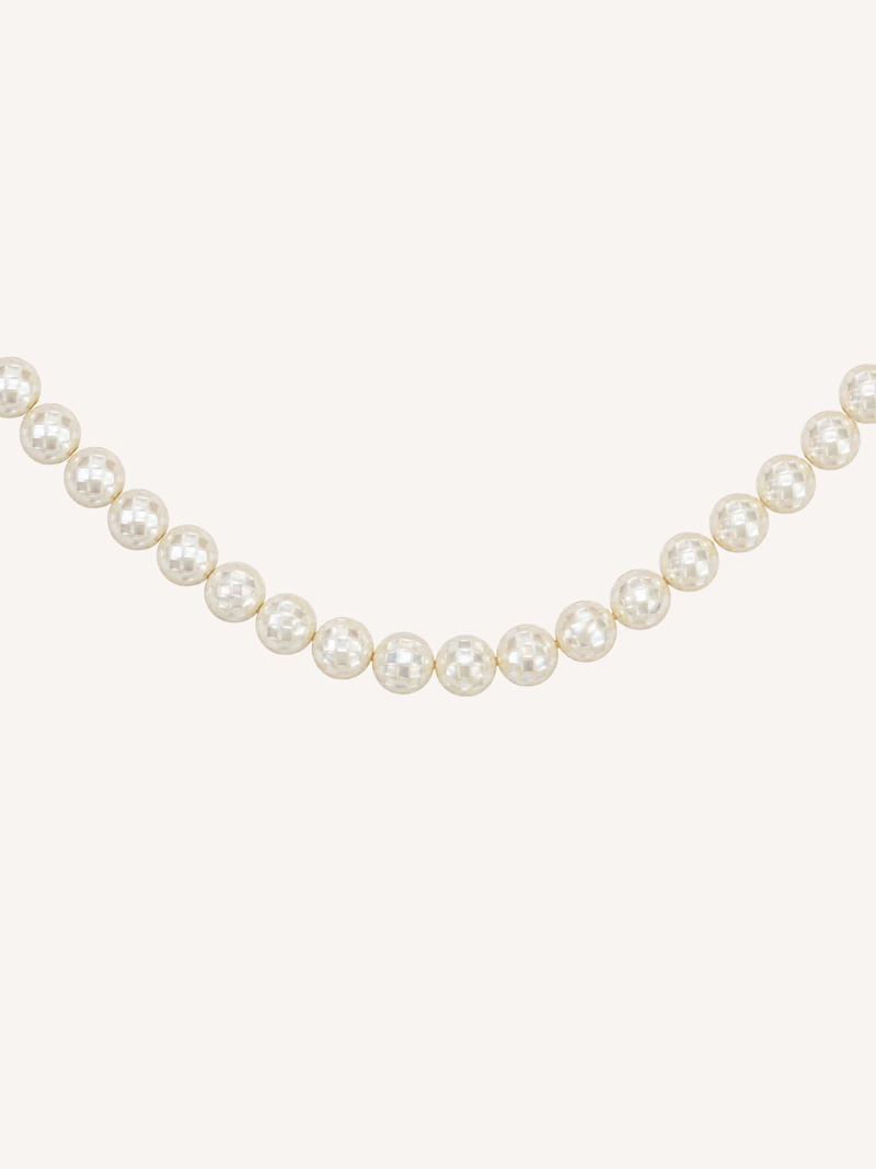 Gold necklace featuring luminous mosaic mother of pearl beads.
