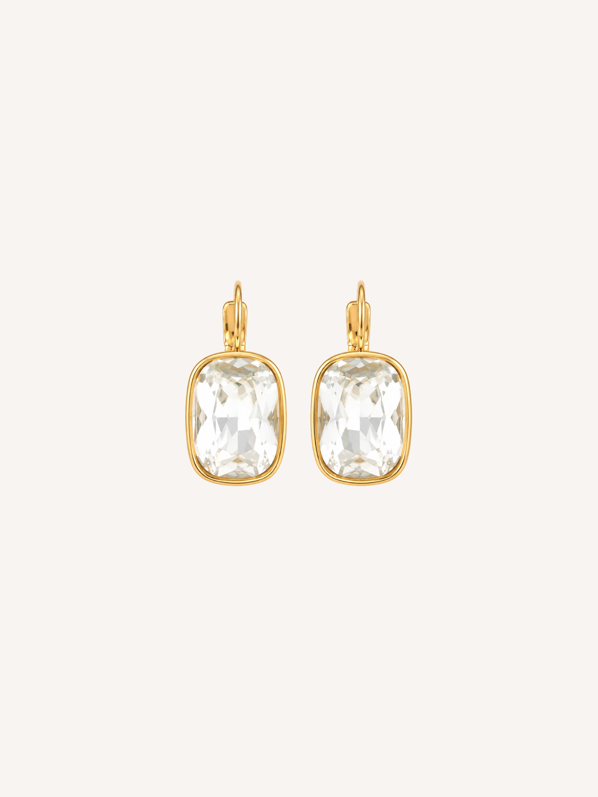 Gold drop earrings featuring large cushion-cut cubic zirconia stones in polished gold settings.