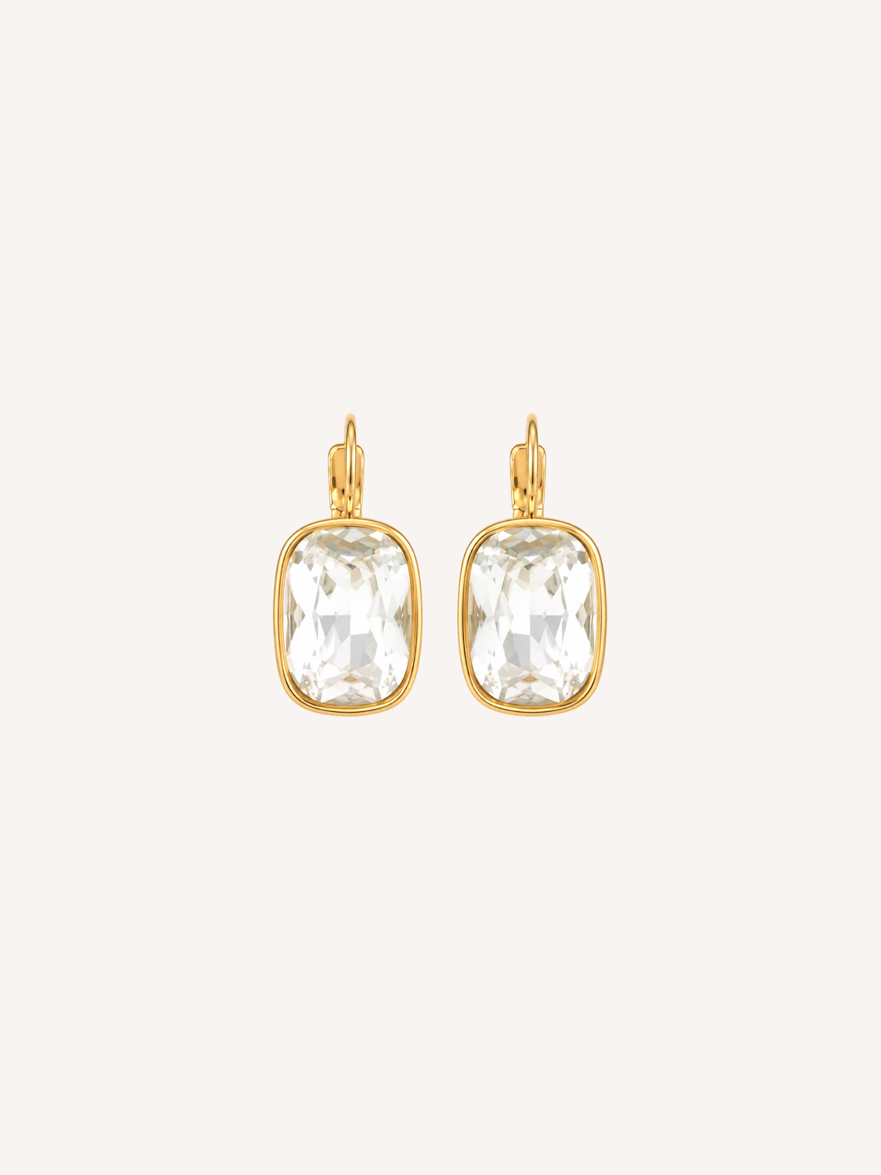 Gold drop earrings featuring large cushion-cut cubic zirconia stones in polished gold settings.