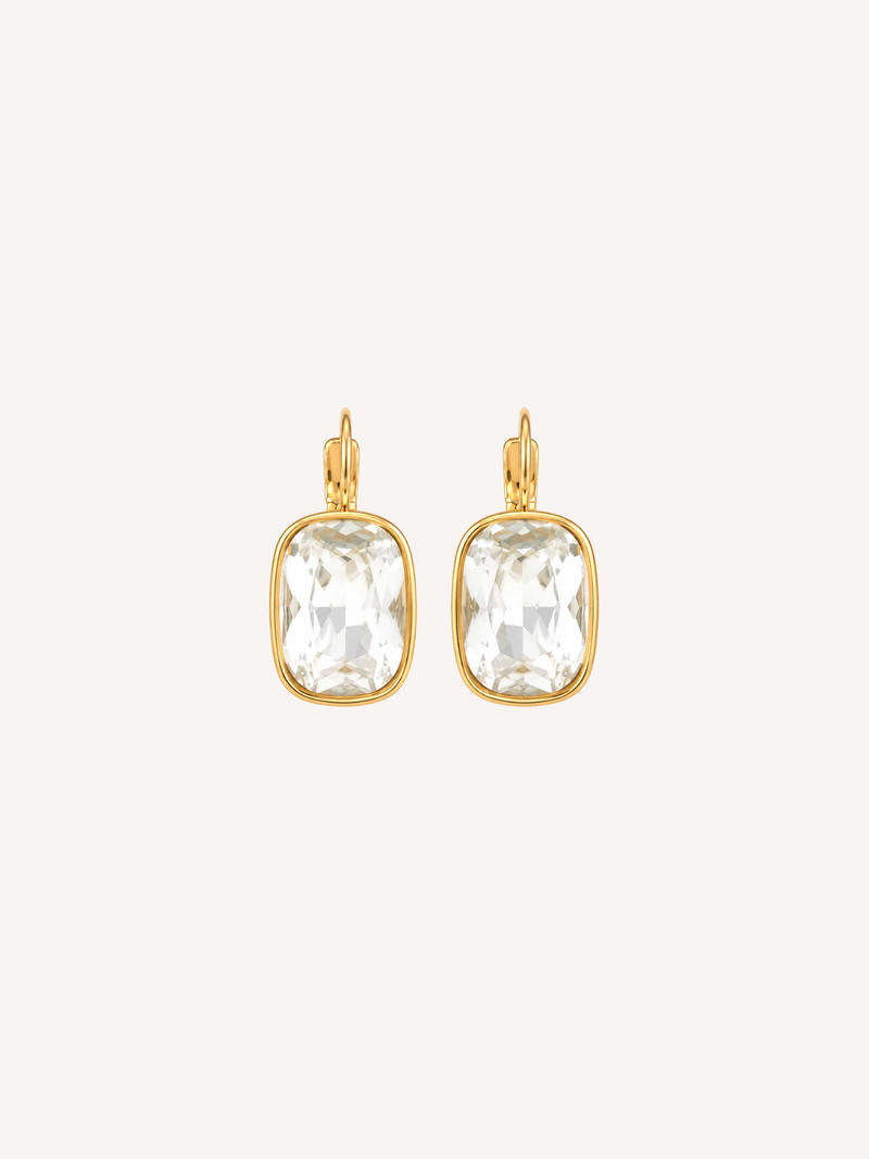 Gold drop earrings featuring large cushion-cut cubic zirconia stones in polished gold settings.