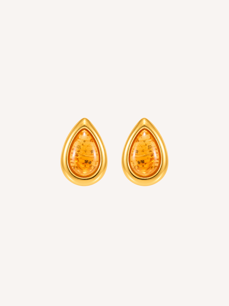 Gold teardrop statement earrings featuring translucent amber resin with gold flecks.