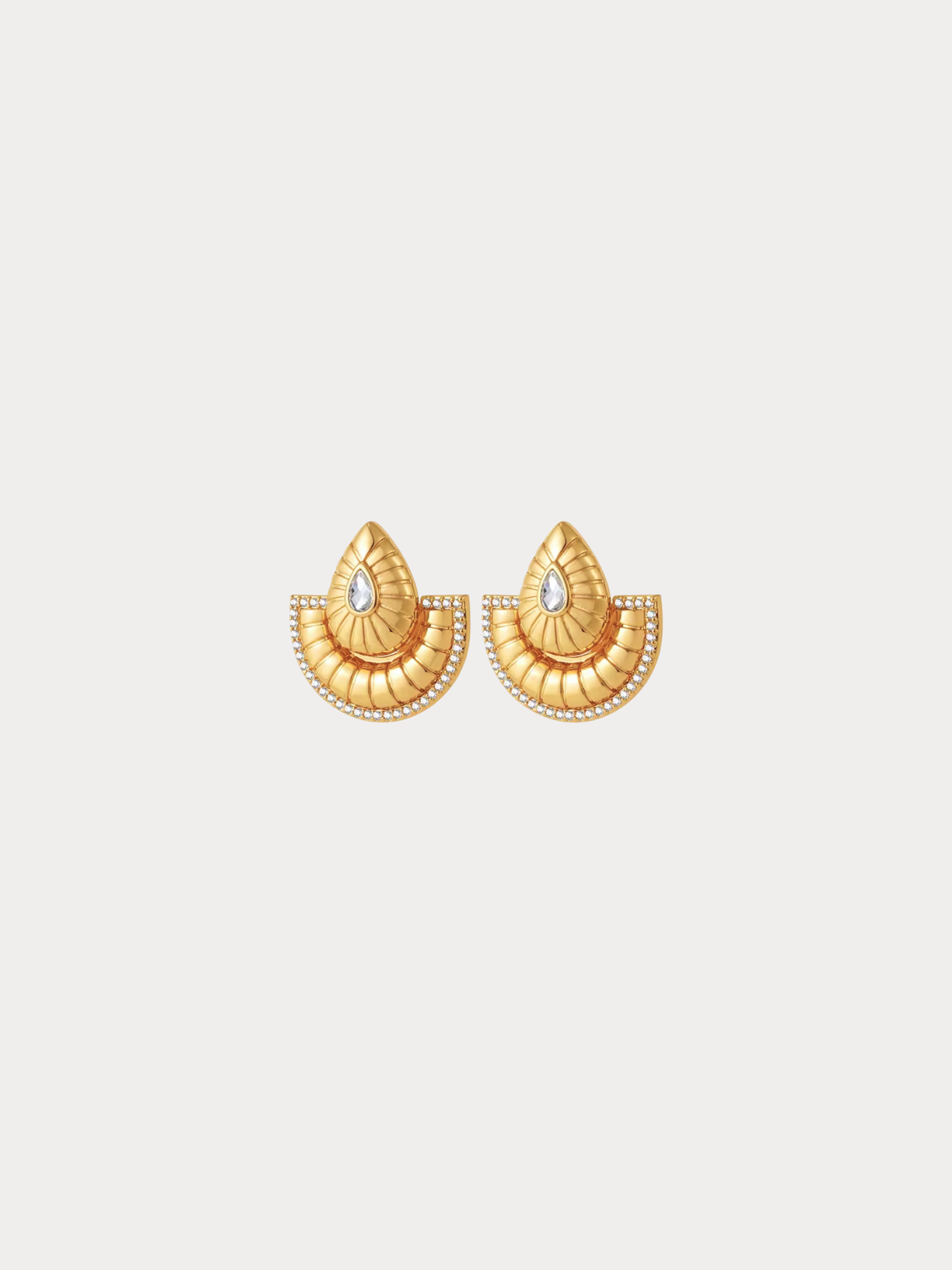 gold fan earrings with sculpted texture and crystal accents inspired by desert sun