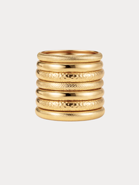 gold stacked bangles with mixed textures and layered festival style
