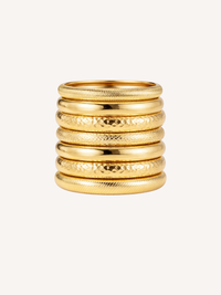 gold stacked bangles with mixed textures and layered festival style