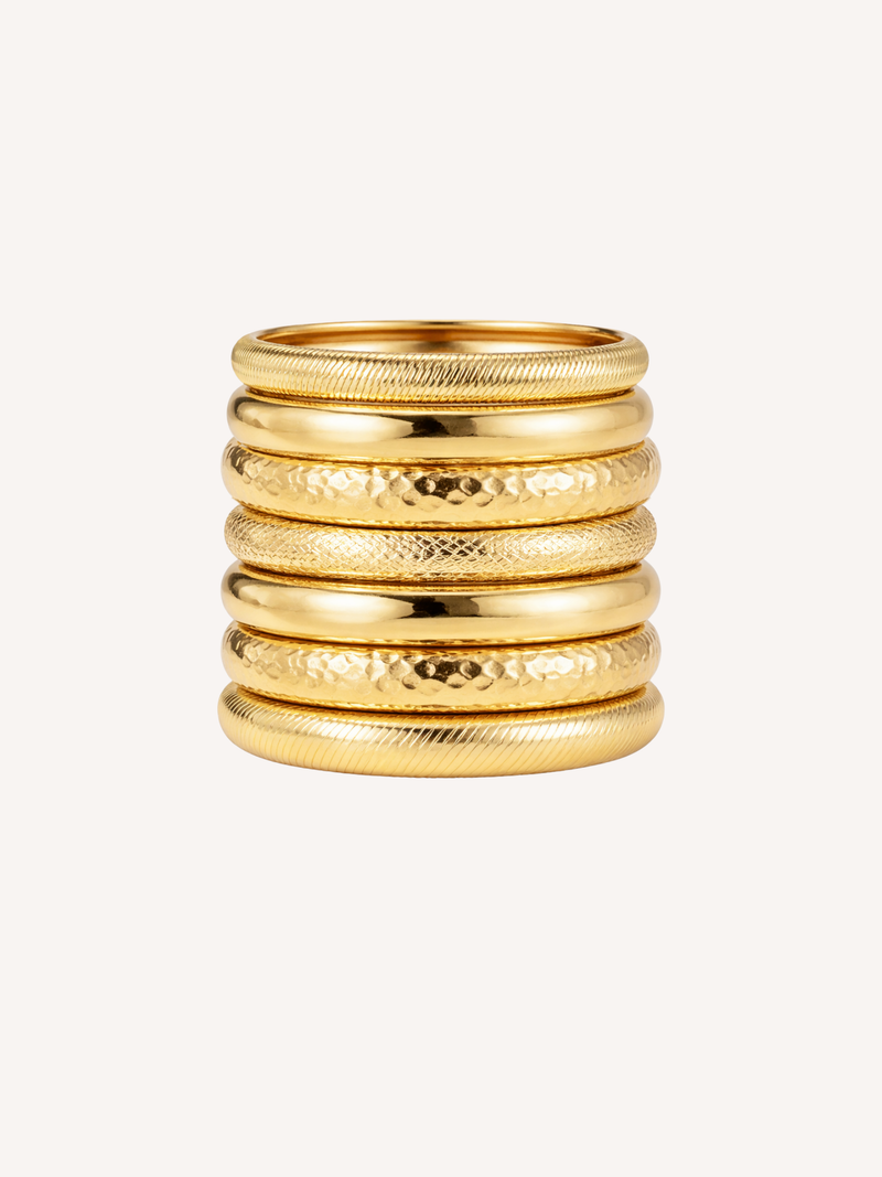 gold stacked bangles with mixed textures and layered festival style
