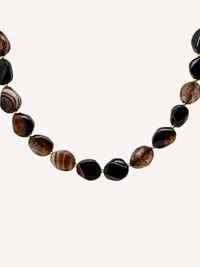 Genuine agate beaded statement necklace featuring polished brown and black natural agate stones with gold spacer beads.