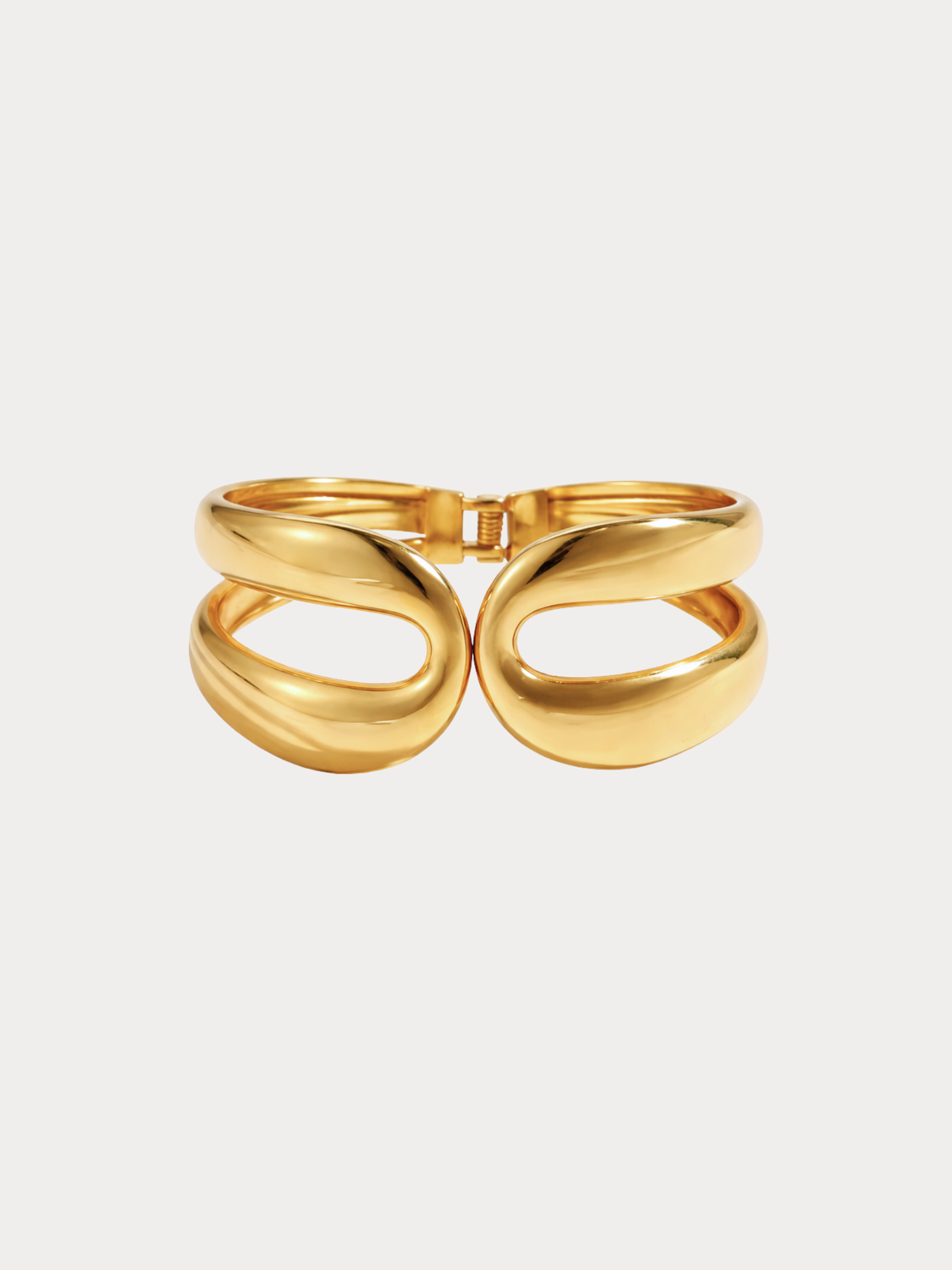 gold sculptural cuff bracelet with fluid organic double loop design