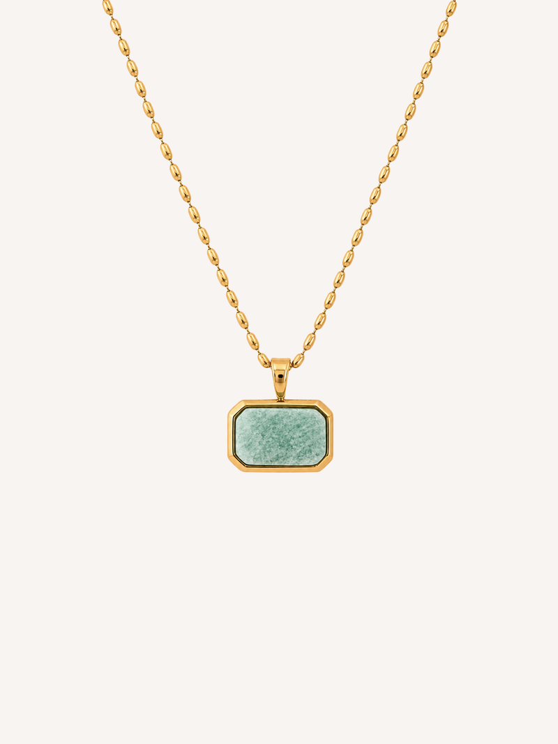 Gold geometric pendant necklace featuring an imitation amazonite stone on a delicate gold chain.
