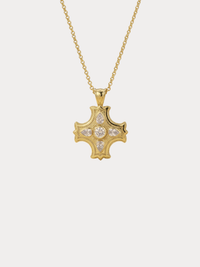 gold cross necklace with center stone and pear shaped accents