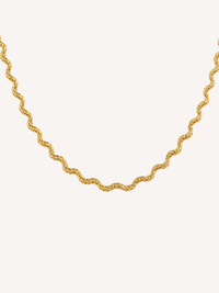 Scalloped gold chain necklace featuring a fluid wave-inspired silhouette and textured finish.